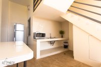 clean kitchen with microwave and fridge